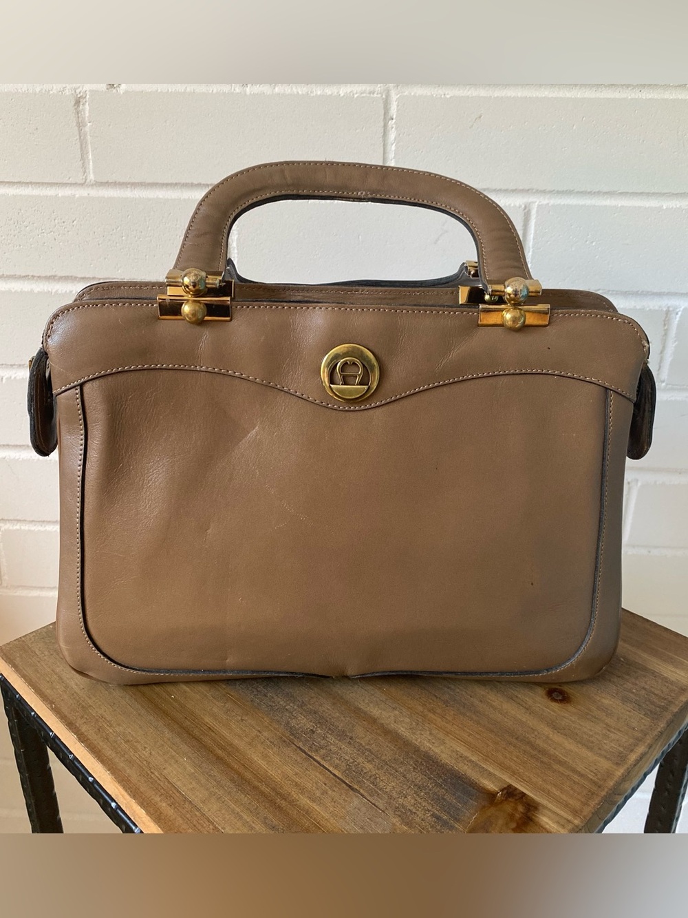 Vintage dark taupe, leather Etienne Aigner handbag with compact mirror accessory